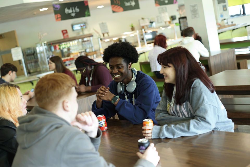 image of students in rooftop restaurant