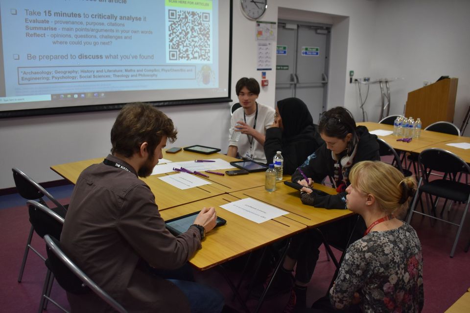 Image of students sat at tables