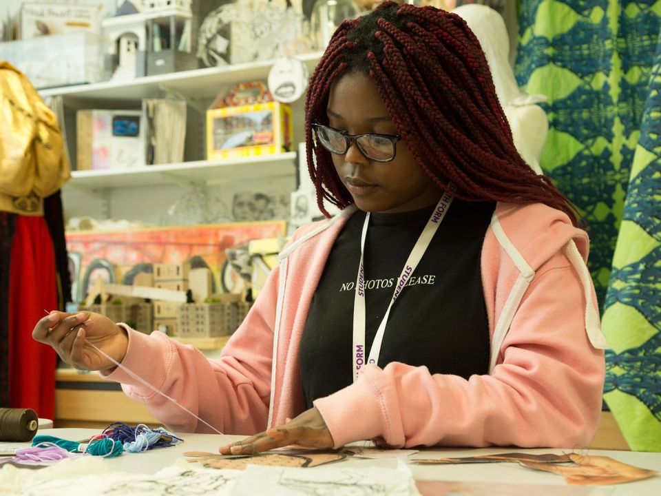 Image of student sewing