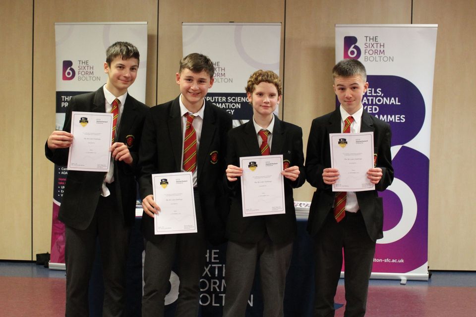 Group of school students with certificates