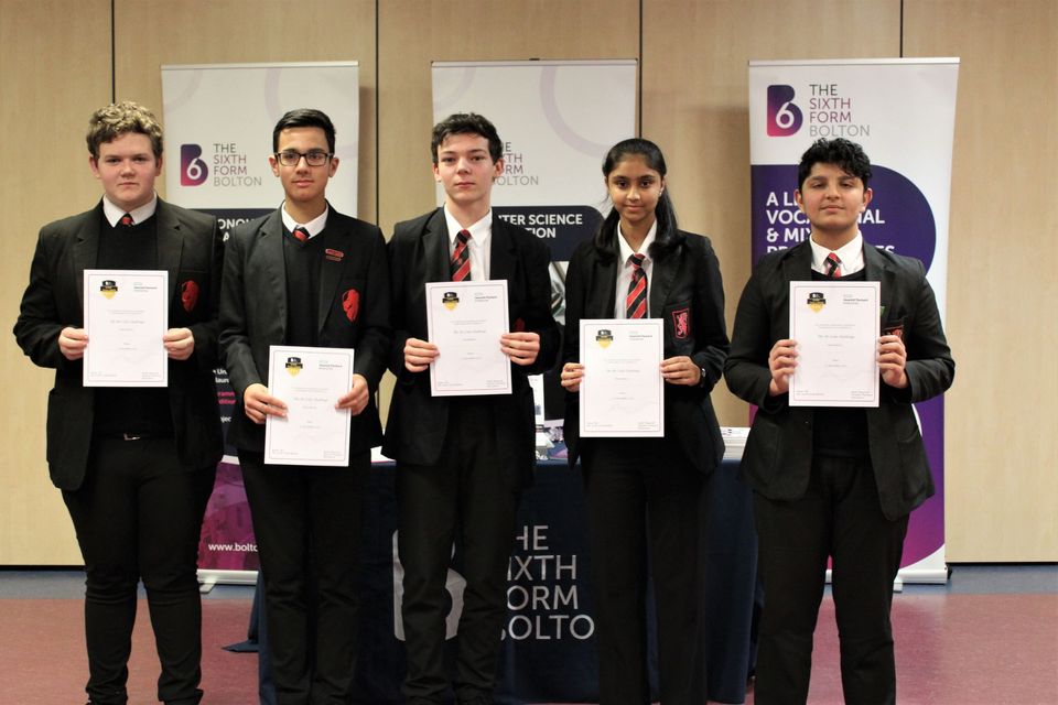 Group of school students with certificates