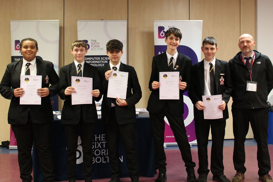 Group of school students with certificates